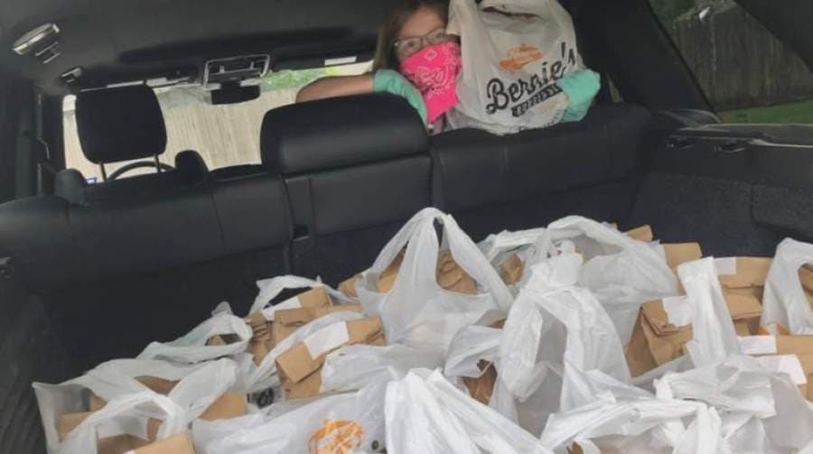 David Atkins and his family delivered 150 meals from Bernie’s Burger Bus to Bellaire, Meyerland, Westbury and Willow Meadows residents April 19. The family will continue those efforts on April 25. (Courtesy David Atkins)