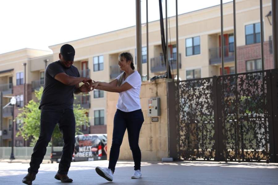 Phillip and Marie Guana dance to Tennessee Whiskey in McCall Plaza in downtown Plano. The two typically dance at Red River dance hall, he said. (Liesbeth Powers/Community Impact Newspaper)
