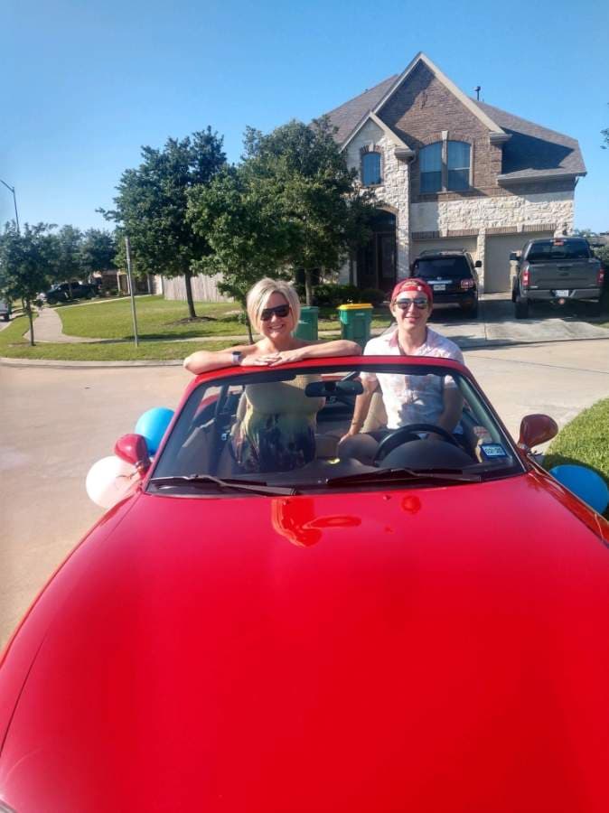 Leslie Feld and her son Cole lead every car parade through Fairfield. (Courtesy Leslie Feld)