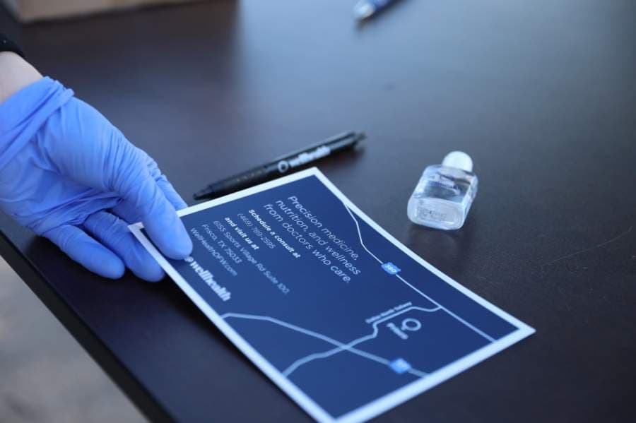 Because wind speeds were too high, members of WellHealth Frisco were unable to conduct drive-thru testing for the coronavirus. Instead, those who came to the event were given coupons for free testing at the Frisco location at a later date. (Liesbeth Powers/Community Impact Newspaper)