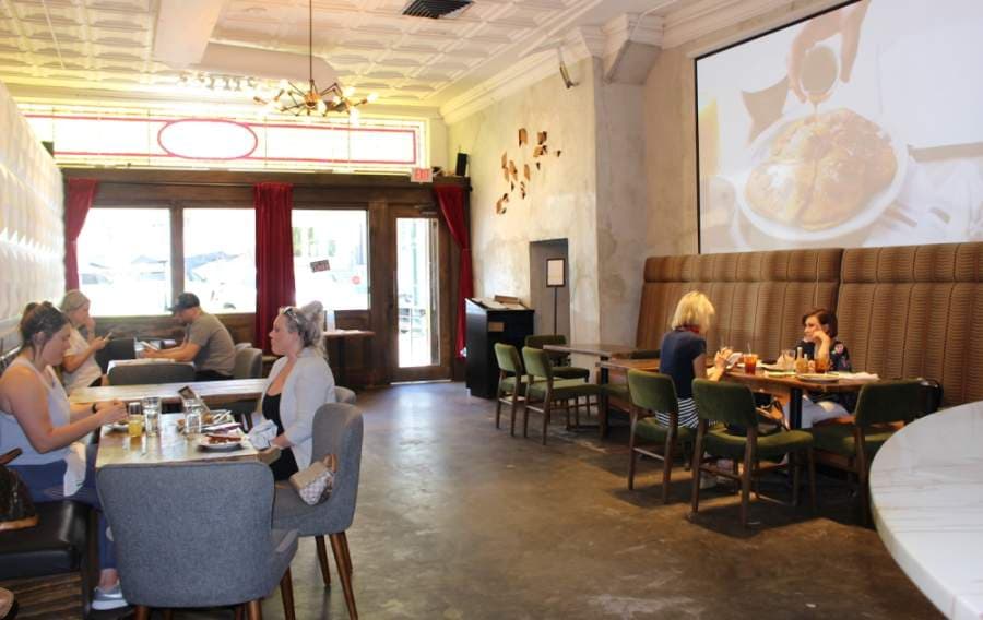 The staff at Layered in McKinney space out seating arrangements to comply with state-mandated orders. (Miranda Jaimes/Community Impact Newspaper)