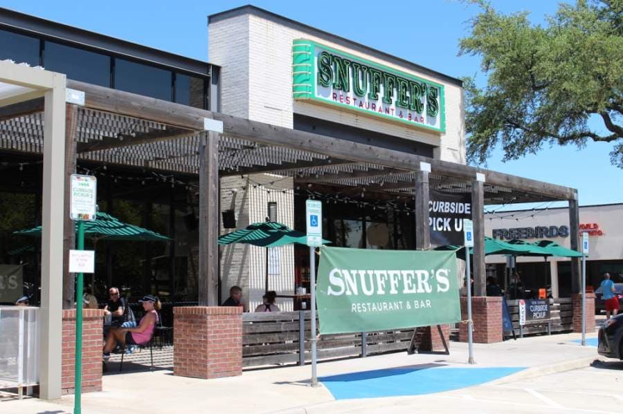 Customers at Snuffer's eat lunch on the patio. (Olivia Lueckemeyer/Community Impact Newspaper) 