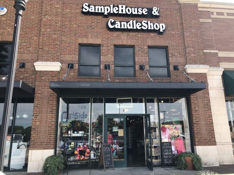 SampleHouse & CandleShop had an open sign posted outside its doors May 1. (Ana Erwin/Community Impact Newspaper)