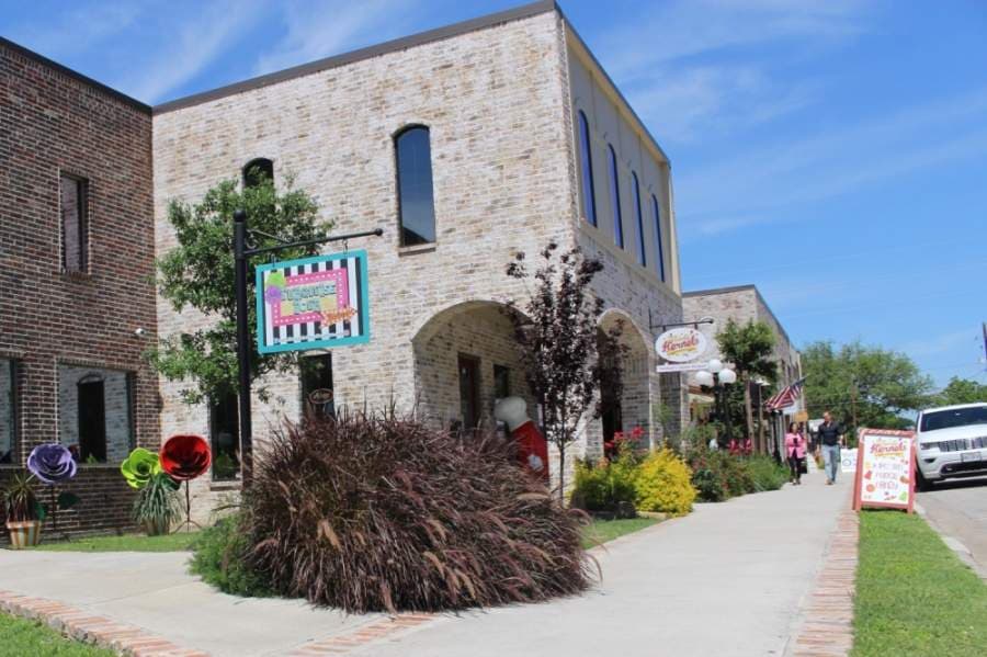Many small businesses in Old Town Tomball, such as Craving Kernels and Market Street Cafe on Market Street, reopened May 1 to customers as some business restrictions were lifted. (Anna Lotz/Community Impact Newspaper)
