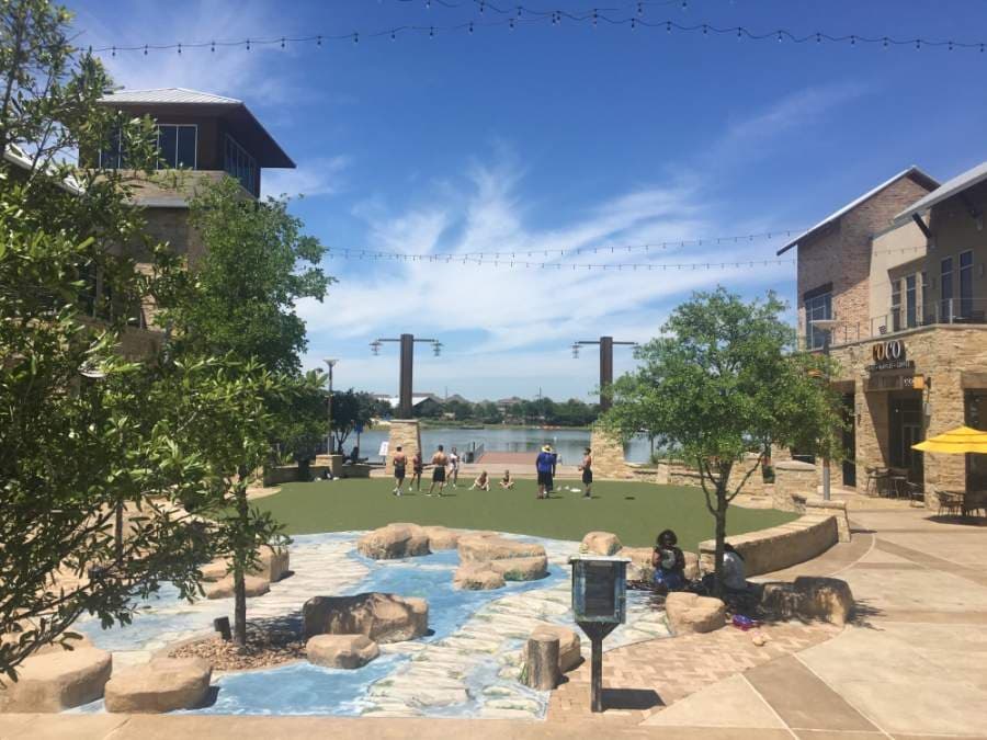 People gather at the Boardwalk at Towne Lake in Cypress on May 1. (Shawn Arrajj/Community Impact Newspaper)