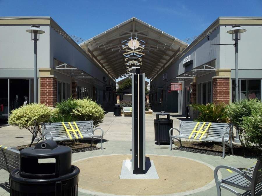 The Houston Premium Outlet Mall in Cypress reopened May 1 with new guidelines to control the spread of COVID-19. Seats were available in the food court, but some benches in communal areas still had barriers May 1. (Shawn Arrajj/Community Impact Newspaper)