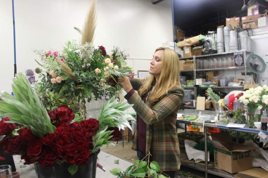A photo of Kim Hanks arranging flowers