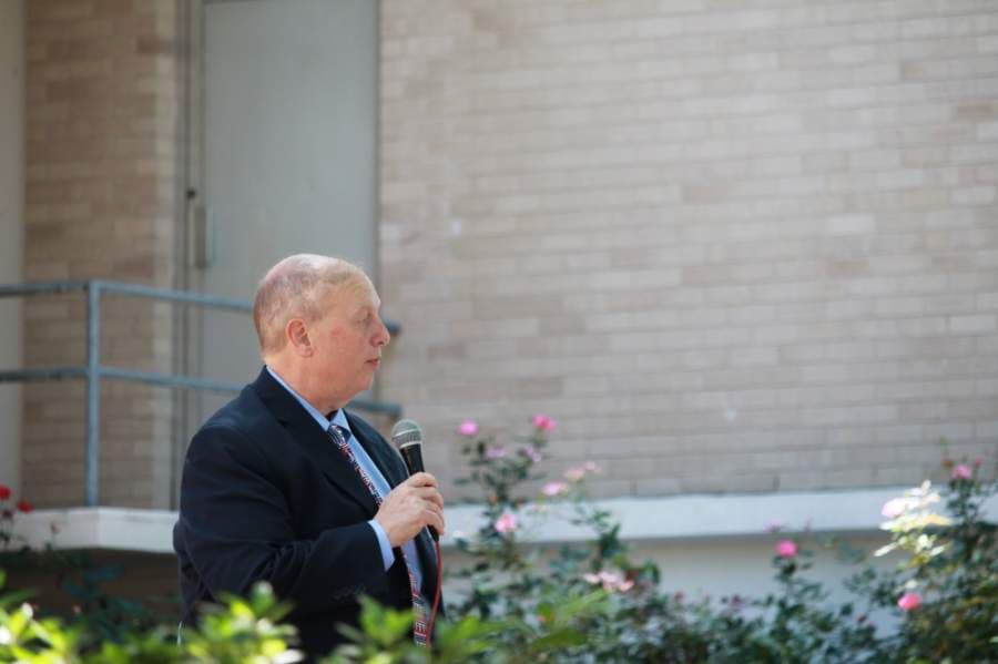 Eric Yollick, a candidate for 475th District Court judge, spoke at the protest in downtown Conroe. (Andy Li/Community Impact Newspaper)