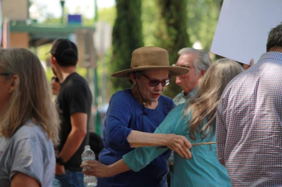 Two protestors symbolically embraced outside the Montgomery County Courthouse. (Andy Li/Community Impact Newspaper)