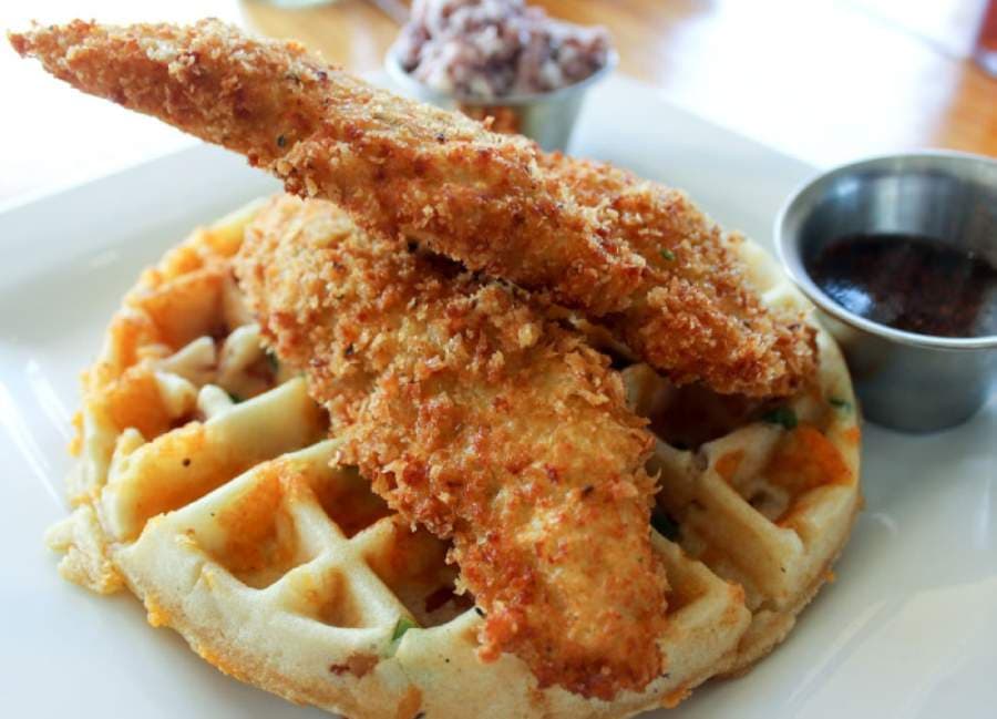 Kings Blu Jam Cafe's signature fried chicken and jalapeno-bacon-cheddar waffles are included in the Mother's Day Brunch Box. (Hannah Zedaker/Community Impact Newspaper)