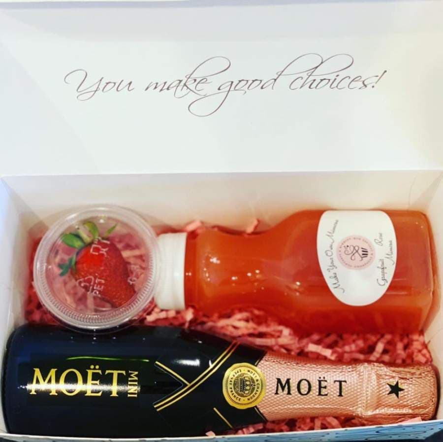 Cupcakes & Bubbles is offering make-your-own-mimosa gift boxes for pickup or delivery, with flavor options of watermelon mint, strawberry orange and grapefruit rose. (Courtesy Cupcakes & Bubbles)