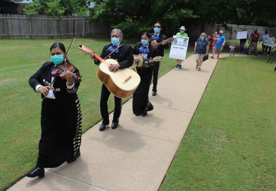 A mariachi band leads the procession to the surprise 75th anniversary party at Brookdale Round Rock on May 5. (Brian Perdue/Community Impact Newspaper)