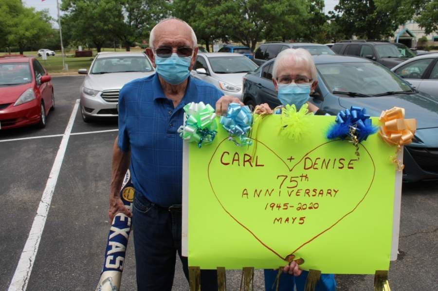 Fred and Karen Grampp made a sign for the occasion. (Brian Perdue/Community Impact Newspaper)