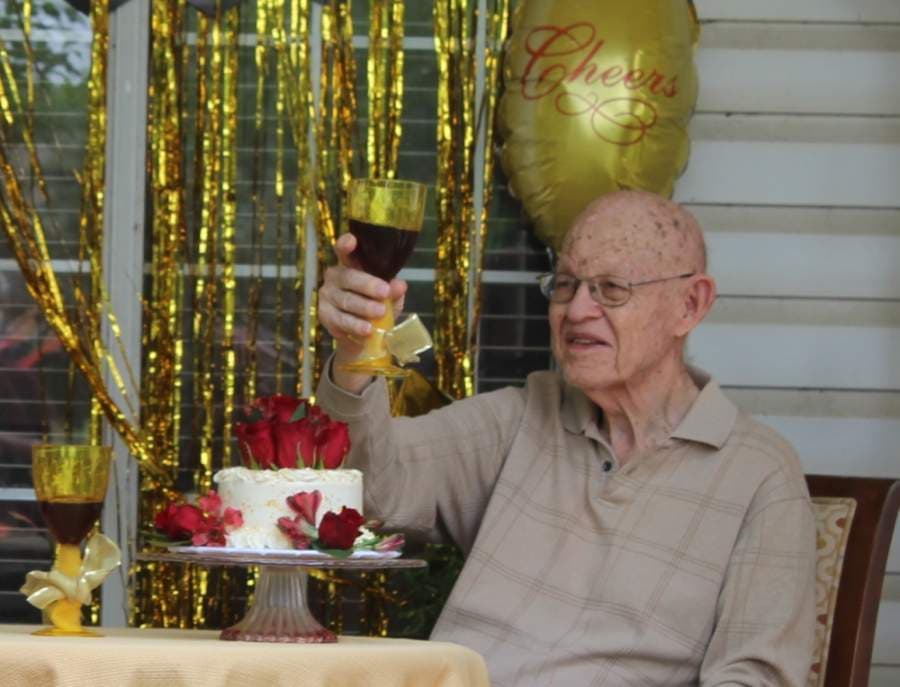 Carl Starnes, 95, toasts the crowd during his and Denise's 75th anniversary surprise party. (Brian Perdue/Community Impact Newspaper)