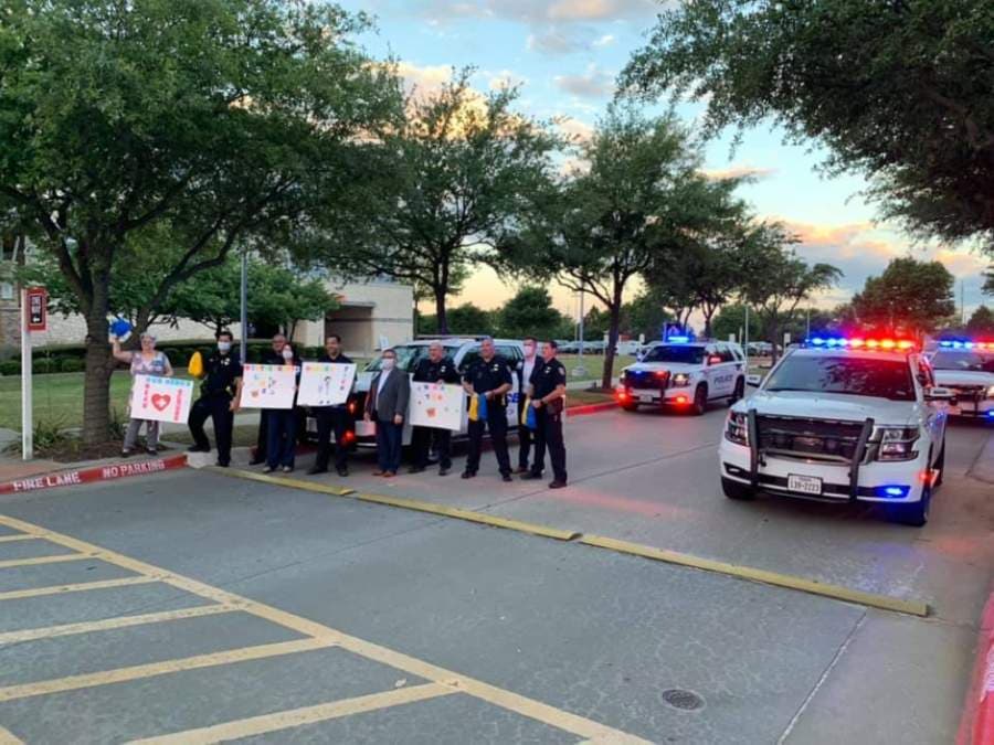 The Frisco Police Department showed up to the morning shift-change cheer in their patrol cars to shine their lights. (Courtesy Tara Yell)