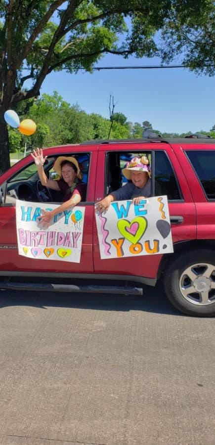 Participants in the April 13 car parade at Carriage Inn Katy made signs for the residents. (Courtesy Carriage Inn Katy)