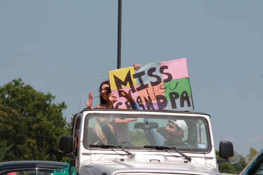 Organized by the Montgomery Area Chamber of Commerce, Montgomery residents drove in front of Live Oak Senior Care May 7 to lift the spirits of its residents and staff. (Andy Li/Community Impact Newspaper)
