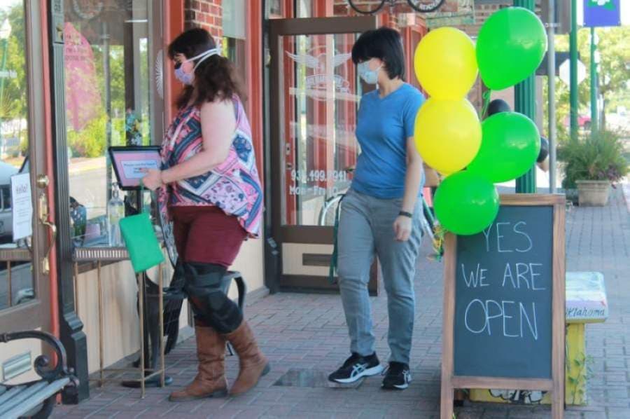 Retailers and restaurants across the state began the process of reopening May 1. Residents entered a store in downtown Conroe that day. (Andy Li/Community Impact Newspaper)