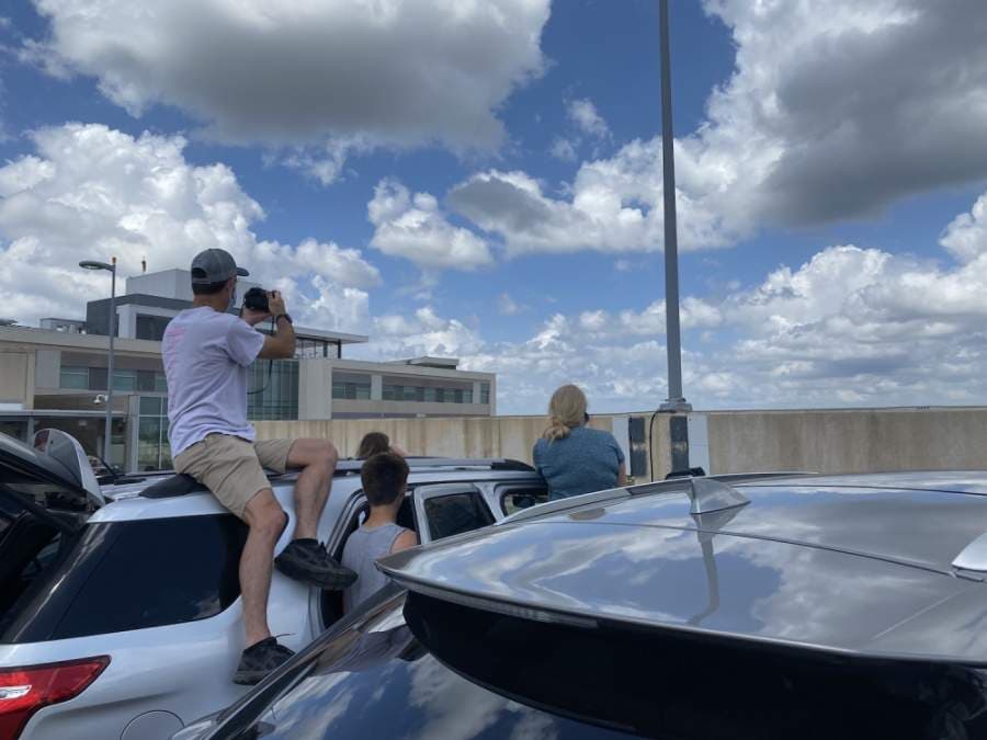 Spectators wait to get a view of the flyover. (Brian Rash/Community Impact Newspaper)