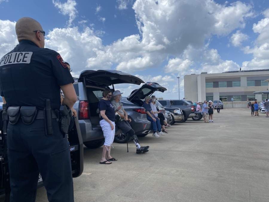 Spectators wait to get a view of the flyover. (Brian Rash/Community Impact Newspaper)