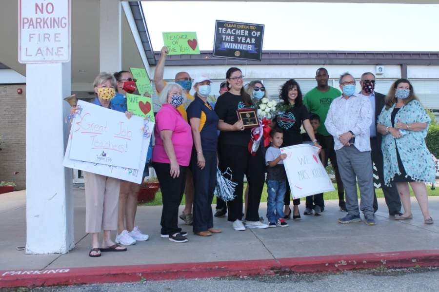 Klister accepted the award May 13 surrounded by family and community members. (Colleen Ferguson/Community Impact Newspaper)