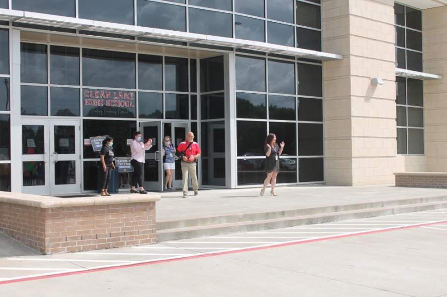 Hawkins (right) and the other teachers honored were surprised with the parades outside their respective schools. (Colleen Ferguson/Community Impact Newspaper)