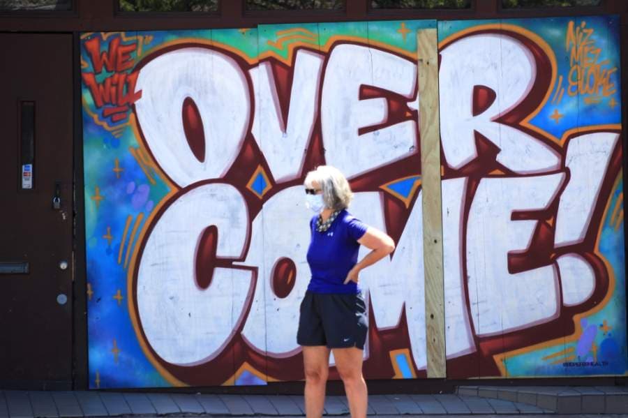 Many bars on Sixth Street remain boarded up, and some were painted by artists from the HOPE Outdoor Gallery. On May 18, Gov. Greg Abbott announced that bars could reopen on May 22. (Jack Flagler/Community Impact Newspaper)