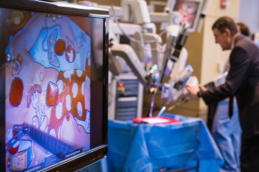 Hugh Brown, CEO of St. David’s Georgetown Hospital, examines the new technology at a Feb. 20 ribbon cutting event celebrating the robot. (Courtesy St. David's HealthCare)