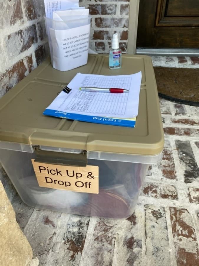 Group members follow safe and sanitary measures when picking up and dropping off supplies. (Courtesy Helping Hands Ladies of Cypress)