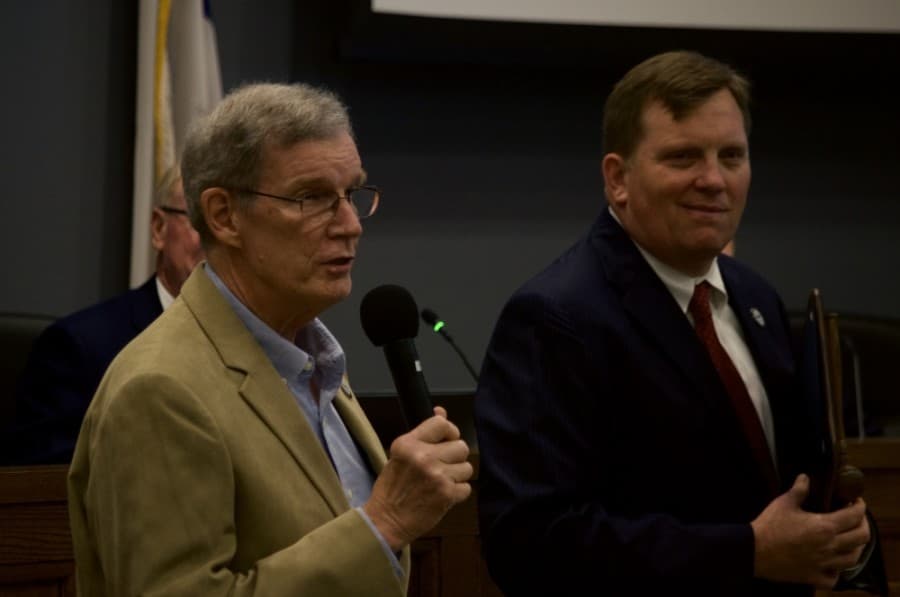 Former Mayor Pro Tem and District 5 council member Wayne Peters (left) stands with former Mayor Barron Casteel (right) at Tuesday's City Council meeting, May 26, 2020. (Warren Brown/Community Impact Newspaper)