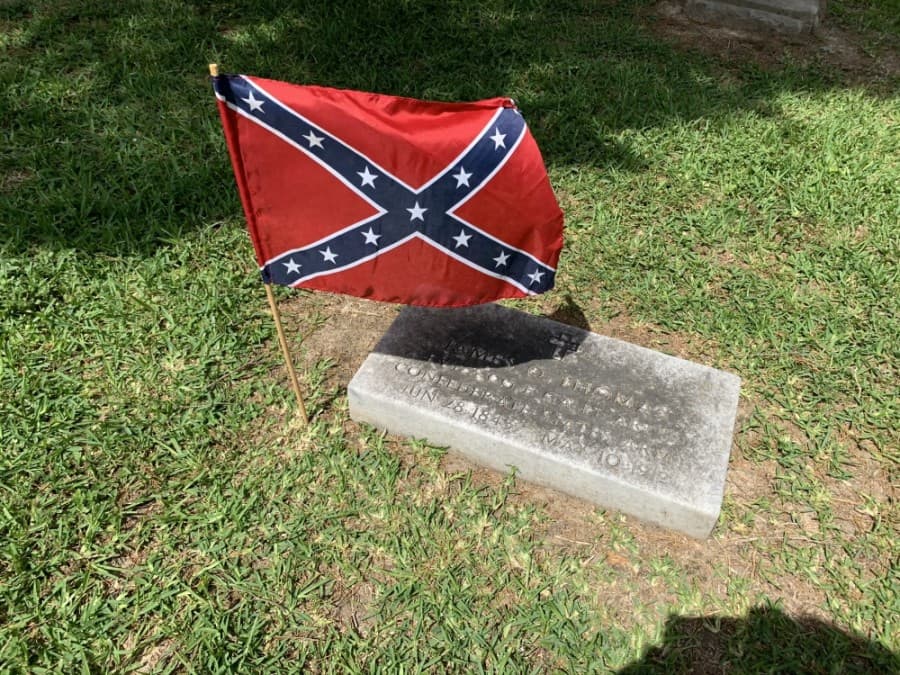 Katy VFW Post 9182 coordinated a small event May 23 to place flags on veterans' graves in honor of Memorial Day. (Courtesy Don Byrne)