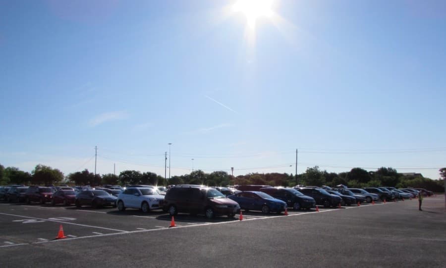 Cars lined up prior to the start of the the 9 a.m. event, with the first arriving prior to 7 a.m. (Nicholas Cicale/Community Impact Newspaper)