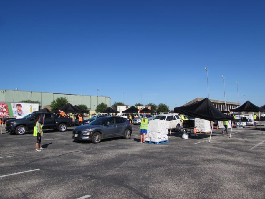 Tents were set up to serve rows of cars at the Toney Burger Activity Center. (Nicholas Cicale/Community Impact Newspaper)