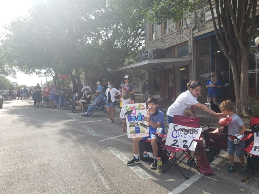 Many spectators cheered on the Georgetown ISD seniors at the May 29 parade. (Ali Linan/Community Impact Newspaper)