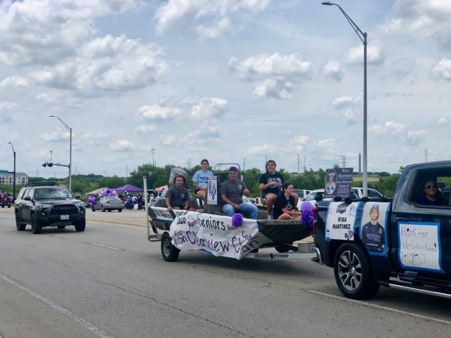 Creative floats carrying seniors and their families drove down McCarty Lane in San Marcos. (Evelin Garcia/ Community Impact Newspaper)