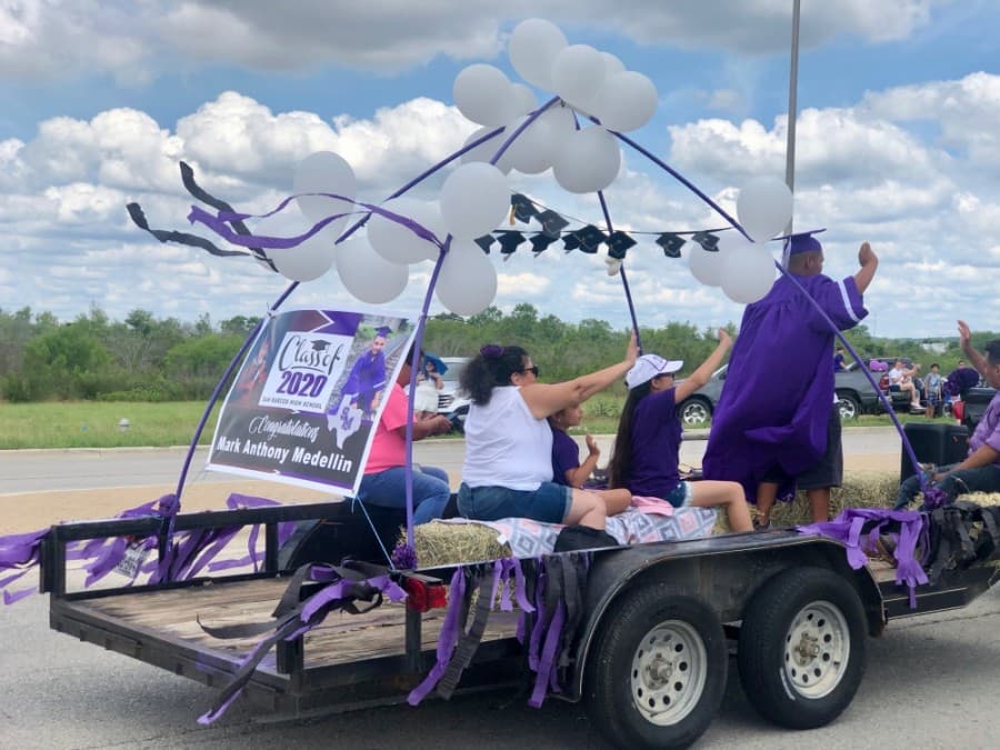 Some parents and family members joined graduates on their floats in the parade. (Evelin Garcia/ Community Impact Newspaper)