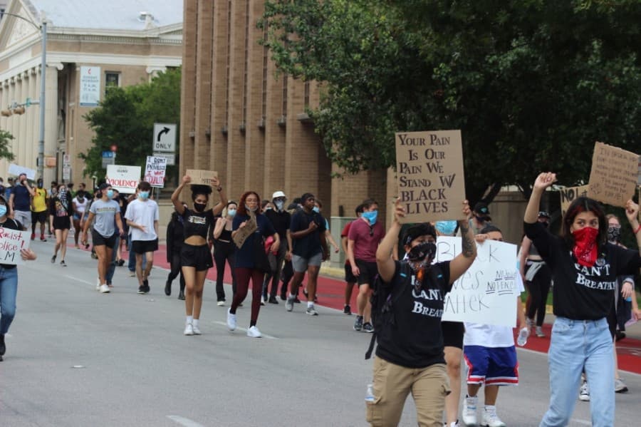 Protesters march toward the Texas Capitol. (Christopher Neely/Community Impact Newspaper)
