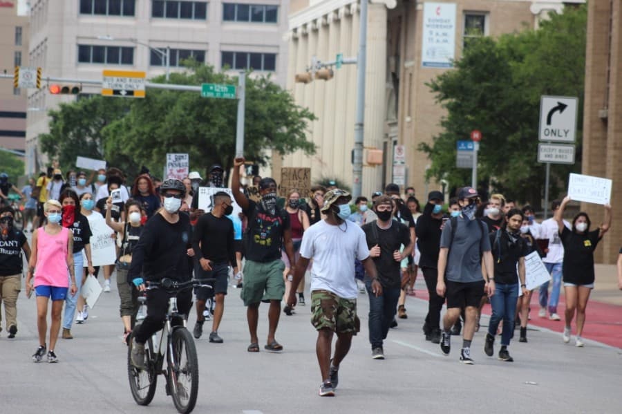 Protesters march toward the Texas Capitol. (Christopher Neely/Community Impact Newspaper)