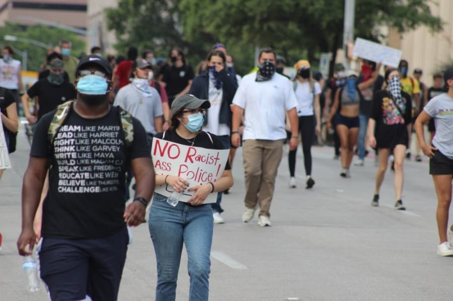 Protesters march toward the Texas Capitol. (Christopher Neely/Community Impact Newspaper)