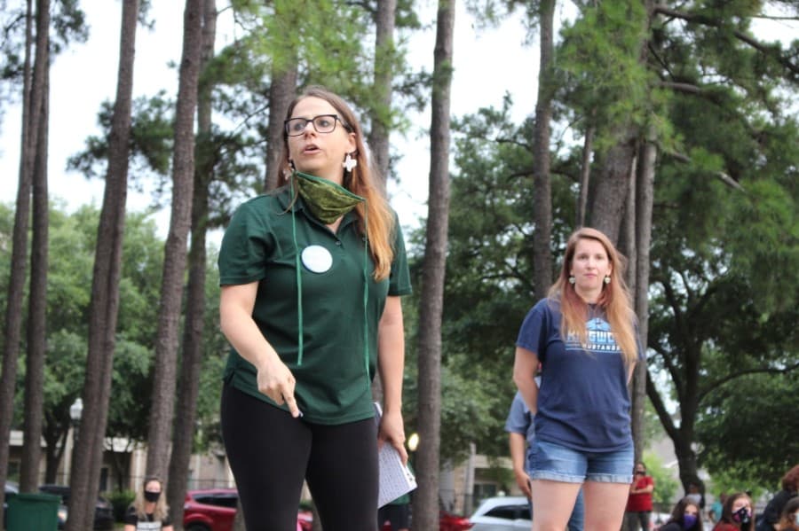 Gabriela Diaz (left), co-organizer and Kingwood Park High School teacher, speaks at the protest honoring George Floyd on June 1. (Kelly Schafler/Community Impact Newspaper)