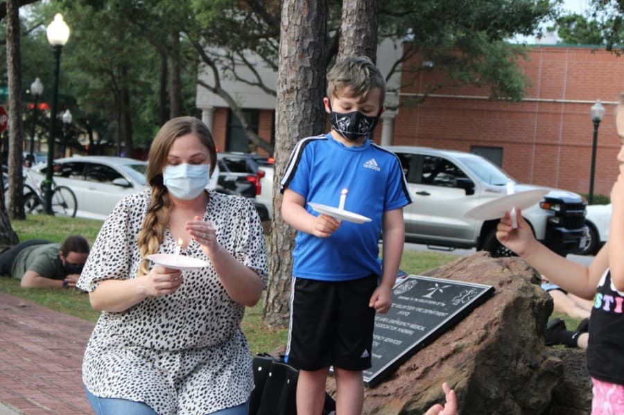 More than 200 people gather at Kingwood Town Center Park on June 1 to peacefully protest the death of George Floyd. (Kelly Schafler/Community Impact Newspaper)