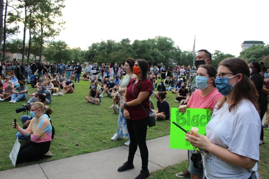 More than 200 people gather at Kingwood Town Center Park on June 1 to peacefully protest the death of George Floyd. (Kelly Schafler/Community Impact Newspaper)