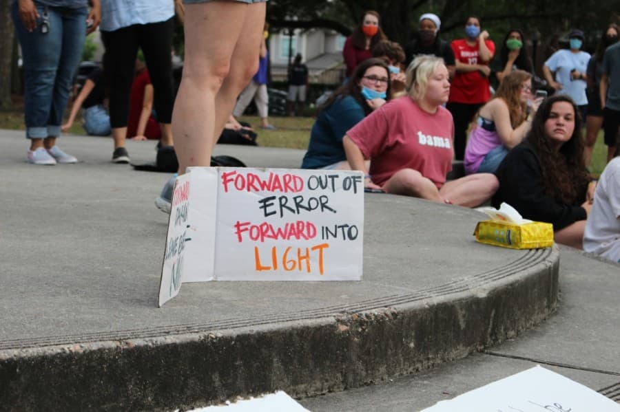 More than 200 people gather at Kingwood Town Center Park on June 1 to peacefully protest the death of George Floyd. (Kelly Schafler/Community Impact Newspaper)