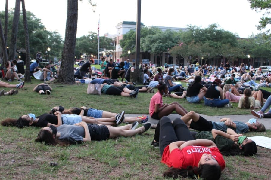 For 8 minutes and 46 seconds, protesters at the Kingwood event lay and sit on the grass of Town Center Park on June 1. (Kelly Schafler/Community Impact Newspaper)