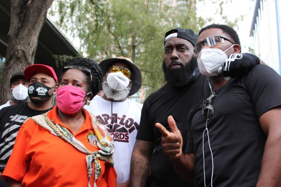 U.S. Representative Sheila Jackson Lee (orange) and Houston rapper Trae tha Truth (black cap) gave speeches at the June 2 march in honor of George Floyd. (Adriana Rezal/Community Impact Newspaper)