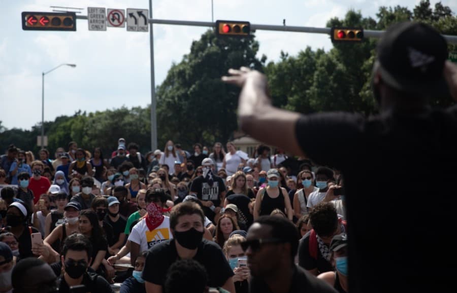A man who identified himself only as Sean spoke to the crowd a second time before encouraging the crowd to listen to a few words from Police Chief Ed Drain. (Liesbeth Powers/Community Impact Newspaper)