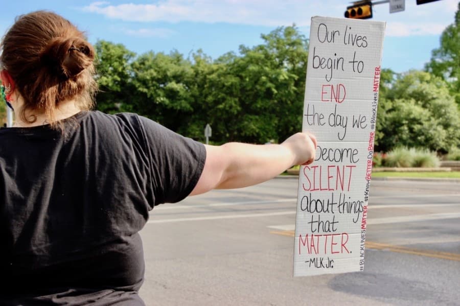 The protest, which takes place nightly at 6 p.m., is located at the corner of Red Bud Lane and Forest Creek Drive in Round Rock. (Taylor Jackson Buchanan/Community Impact Newspaper)