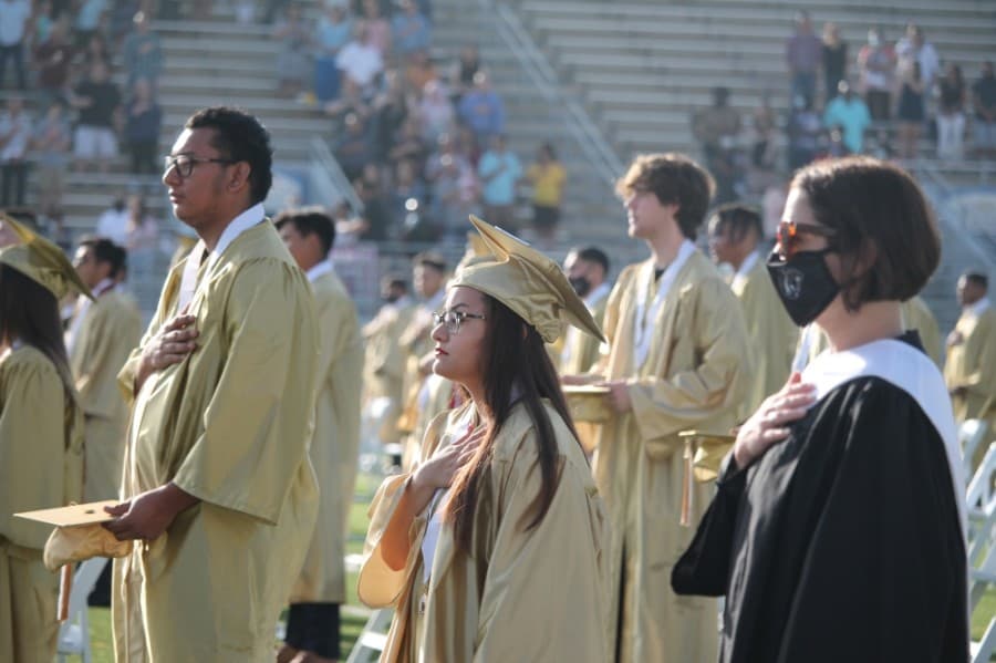 While almost all graduates went without masks during the ceremony, most teachers wore face masks. (Andy Li/Community Impact Newspaper)