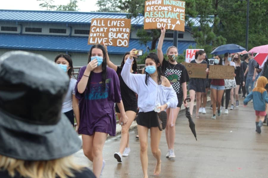 Protestors chanted as the rain began to let up during a June 3 protest. (Andrew Christman/Community Impact Newspaper)