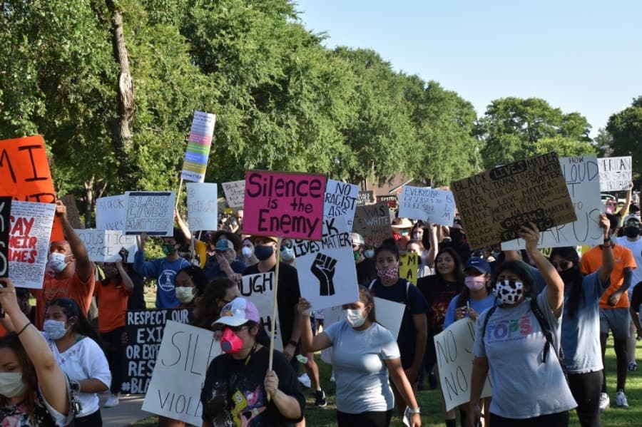 A procession around the park was accompanied by chants calling for an end to racial injustice and police brutality. (Makenzie Plusnick/Community Impact Newspaper)